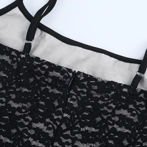 Detail of black floral lace fabric with adjustable straps and invisible back zipper