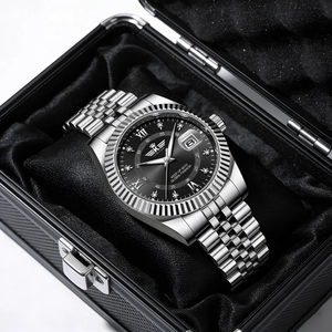 Detailed macro shot of a men's luxury silver steel watch with black dial in a display box