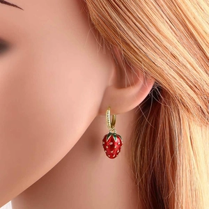 Chic gold-plated hoop earrings with vibrant red strawberry pendants for a fresh look
