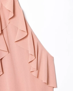 Close-up of the delicate pink ruffled layered texture and fine fabric of the halter top