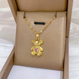 Charming gold-plated bear necklace with pink heart crystal on a dainty water wave chain