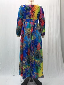 Macro detail of royal blue Baroque pattern and silky texture on long-sleeved dress