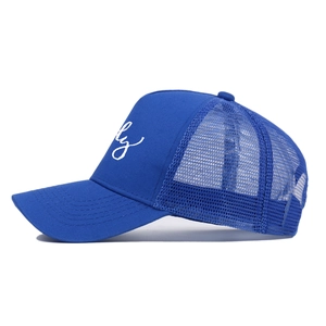 Detailed side view of blue cotton mesh trucker hat with white daddy embroidery