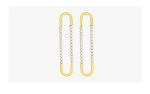 Macro view of gold plated U-shaped geometric earrings with sparkling zircon pave detail