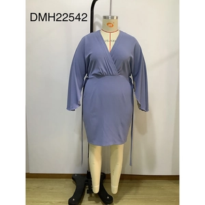 Detail of lavender purple V-neck plus size dress with lantern sleeves and belted waistline