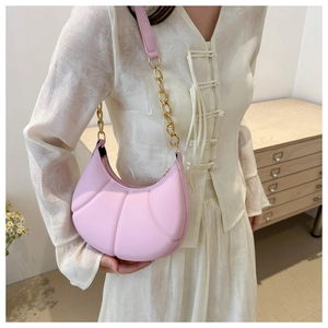 Pink crescent underarm bag with shell pleated texture and golden chain strap for women