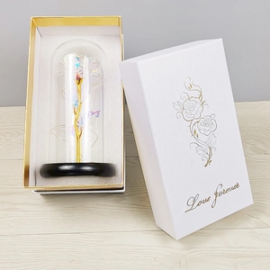 Detail of gold foil rose in glass dome with LED lights and Love Forever gift box