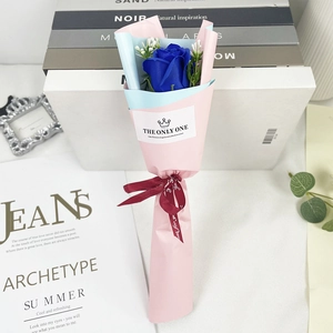 Detail of a single blue soap rose bouquet in pastel paper with Just for you ribbon