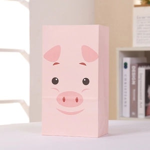 Detail of pink cartoon pig gift bag made of durable kraft paper for farm parties
