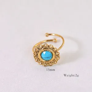 Detail view showing a 15mm diameter turquoise stone on a bohemian gold open ring