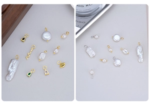 Macro view of handmade S925 silver and baroque pearl charms with gold plated details