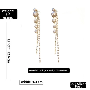 Detail view of long tassel earrings with grey pearls and dimensions 12.6cm by 1.3cm