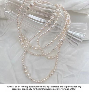 Detail of multi-layer natural freshwater baroque pearl necklace on glass decor