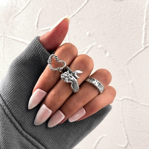 Hip hop style vintage silver rings featuring heart, dragon and butterfly embossed designs