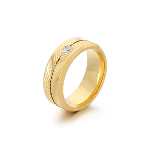 Elegant gold feather textured stainless steel ring with a round clear zircon stone