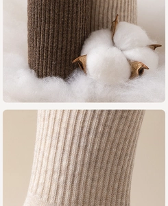 Detailed macro view of brown and beige ribbed knit cotton socks showing fabric texture