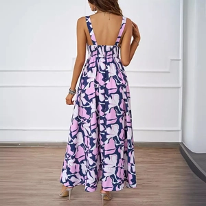 Floral print backless maxi dress with thin straps and elastic waist on a female model