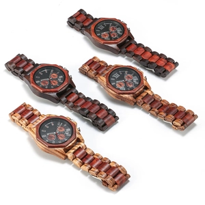 Detail view of four multi-functional sandalwood quartz watches in various wood grain finishes