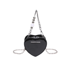 Mini black heart-shaped lacquer bag with silver chain strap and pearl handle detail