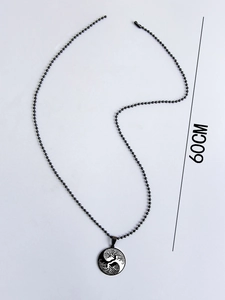 Detail of 60cm black ball chain necklace featuring a Yin Yang Tree of Life pendant