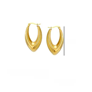 Macro detail of gold stainless steel hoop earrings with size measurements of 3.7cm height