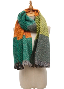 Close-up of color-block knit scarf with orange and green patterns and fringed edges