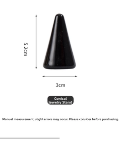 Macro view of black cone jewelry stand showing smooth finish and 5.2cm height scale