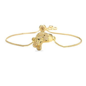 Detail of gold-plated leopard head bracelet with micro-paved zircons and adjustable chain