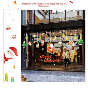Detail view of double-sided Christmas window decals with Santa and festive patterns