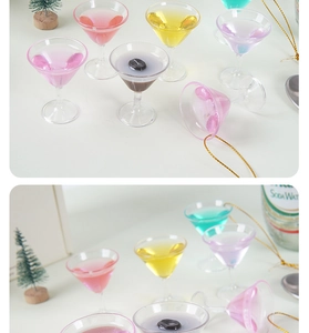 Miniature cocktail glass ornaments with colorful liquid and festive gold hanging loops