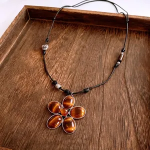 Vintage tiger eye stone flower pendant necklace with black braided cord and beads
