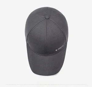 Top view of dark grey baseball cap showing six-panel stitching and embroidered logo