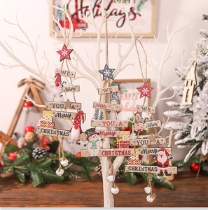 Detailed view of layered wooden Christmas tree ornaments with Santa and snowman motifs