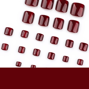Glossy wine red cat eye square press-on toenails kit in various sizes on white background