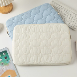 Padded cloud quilted tablet sleeve in beige and light blue with secure metal zipper