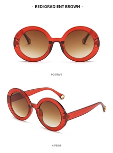Retro round red sunglasses with gradient brown lenses from front and side view
