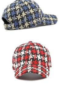 Detail of houndstooth baseball caps with thick tweed fabric and metal adjustable buckles