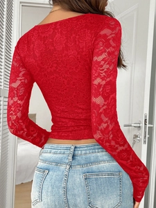 Detail of red lace long sleeve crop top featuring a sexy V-neck back design