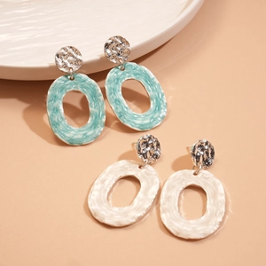 Vintage enamel earrings set in mint green and creamy white with textured silver disks