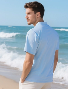 Detail of light blue men's polo shirt with breathable knit texture and slim fit design