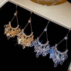 Elegant gold and silver plated teardrop fringe earrings with marquise cubic zirconia stones