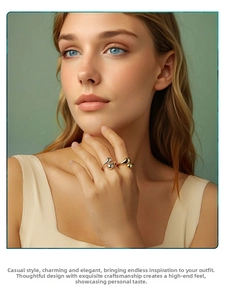 Close-up of elegant gold and silver teardrop rings showing smooth polished finish