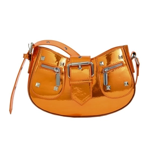 Orange glossy patent leather motorcycle bag with silver rivets and zippers on white background