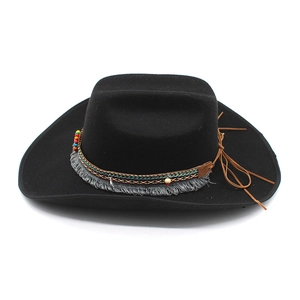 Detail of black felt fedora with colorful woven band, beads, and boho fringe accents