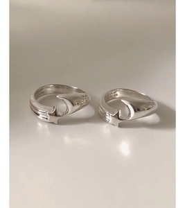 Detailed close-up of 925 sterling silver moon and star rings with S925 engraved hallmarks