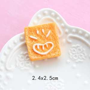 Macro shot of 2.4x2.5cm resin toast bread charm with smiling face for DIY crafts