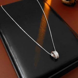 Detail of 18K gold plated necklace with interlocking circles and sparkling cubic zirconia
