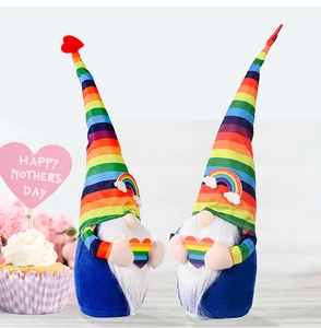 Detail of two rainbow gnomes holding hearts with Mother's Day decorations