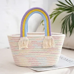 Detailed shot of a woven tote bag with rainbow handles and stylish tassel accents