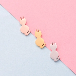 Polished stainless steel cat-shaped pendants in rose gold, gold, and silver finishes